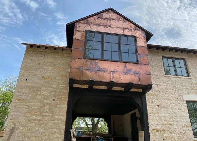 Copper metal panel facade on a stone building for Metal Roof Coating in Lexington